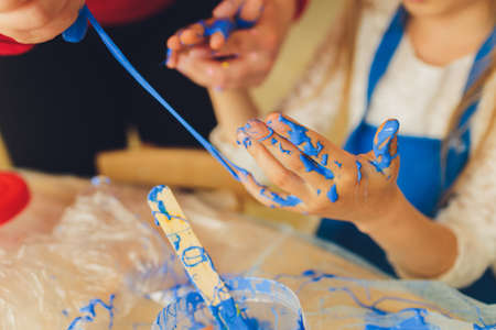 Ingredient for make home made Toy Called Slime, Teenager having fun and being creative homemade slime. Selective focus on Slime.の写真素材