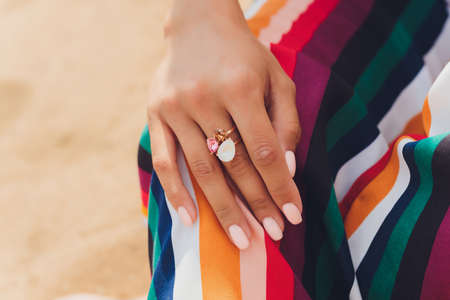 close up of boho styled woman hands with silver jewelry.の写真素材
