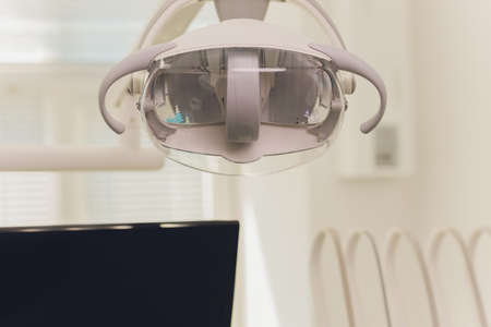 Metallic dentist tools close up on a dentist chair in Dentist Clinic.の写真素材