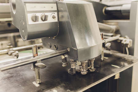 Print screening metal machine. Industrial printer. Serigraphy workshop.の写真素材