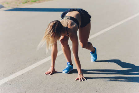 healthy lifestyle sports woman running on asphalt driveway.の写真素材
