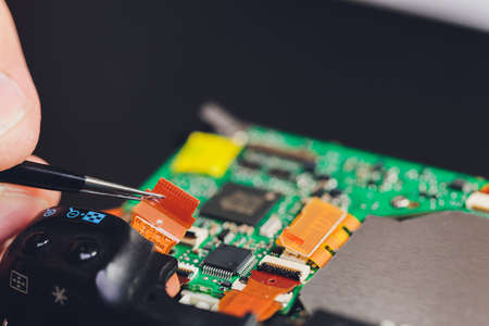 Engineer and technician Minitures are fixing camera mirror box assembly , Miniture workers are...
