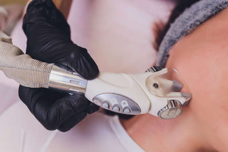 Lymphatic drainage massage LPG apparatus process. Therapist beautician makes a rejuvenating facial...