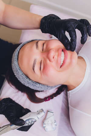 Lymphatic drainage massage LPG apparatus process. Therapist beautician makes a rejuvenating facial...