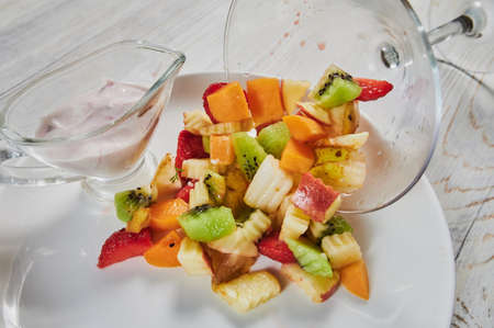 plate with fresh mixed fruits on white background.の写真素材