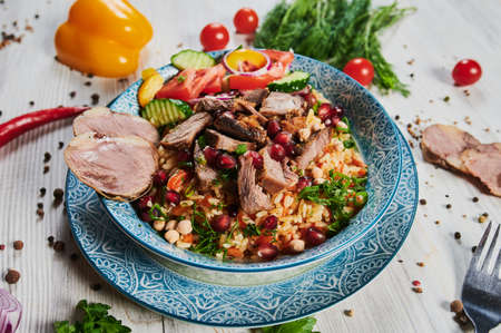 Rice pilaf with lamb meat and vegetables.
