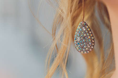 Close-up of bridal neck with elegant earring in ear.の写真素材