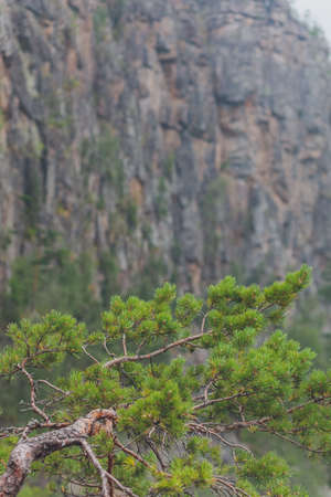 Rocks of Aigir in the smoke of a forest fire. Bashkortostan.