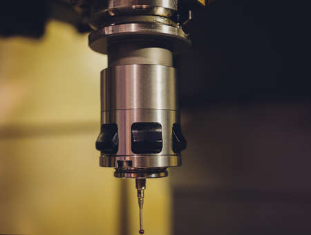 machine for welding steel pipes in a factory.
