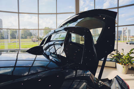 Open back door car indoor SUV close-up.