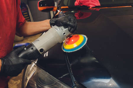 Hands with Auto polisher. Car repair service.の写真素材