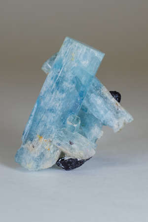 Amazing colorful Quartz Rainbow Flame Blue Aqua Aura crystal cluster closeup macro isolated on white background.の写真素材