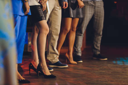 businesswoman standing out of the crowd female feet close-up.