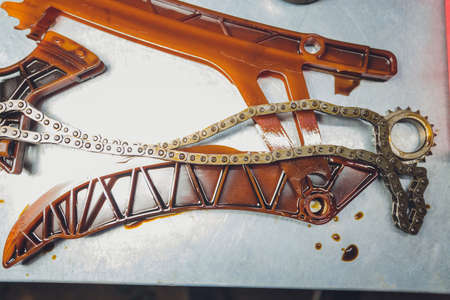 The iron gearbox of a car s transmission disassembly of the transmission chain and parts, repair.