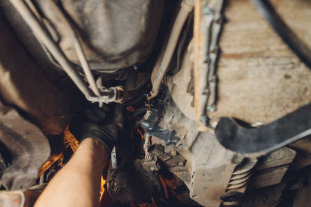 The iron gearbox of a car s transmission disassembly of the transmission chain and parts, repair.