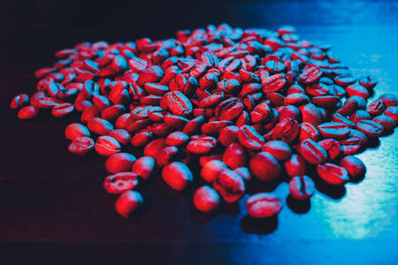Arabica coffee beans on a stone background. Dark coffee beans on rustic background. Close up. Top view.の写真素材