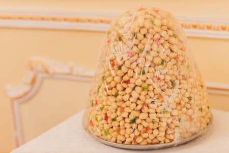 national dish chuck chuck on a blue table laid out by a hill on a background of a samovar and pies. Traditional Eastern tea party. Sweets of Central Asia.の写真素材