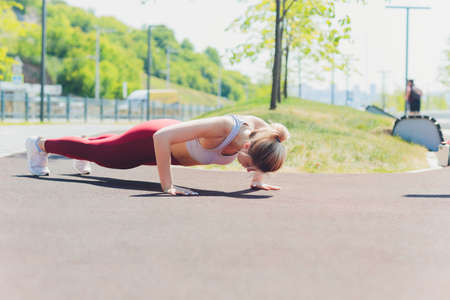 young Sporty woman doing stretching exercise promenade.
