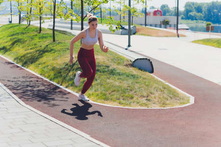 young Sporty woman doing stretching exercise promenade.