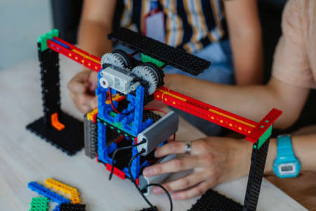schoolboy study in a robotics class, assemble a robot constructor.の写真素材