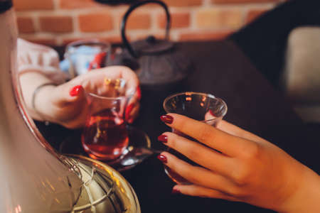 people at the festival hold alcoholic cocktails in their hands.の写真素材