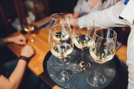 Refreshing White Wine in a Glass on a Background.の写真素材