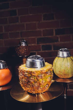 Shisha With Fruit Bowl With Colorful Smoke In Hookah Bar Closeup.