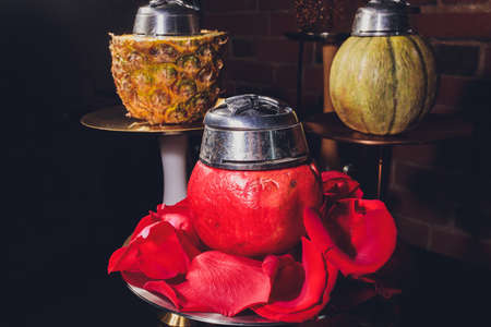 Shisha With Fruit Bowl With Colorful Smoke In Hookah Bar Closeup.