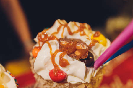 Glasses of milkshake, frappe, ice coffee and smoothie with whipped cream.の写真素材