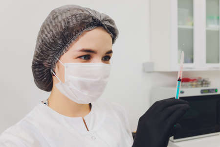 Dentist and patient choosing treatment in a consultation with medical equipment in the background.