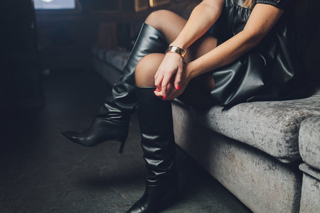 style. fashion. shoes. high womens black boots. beautiful female legs.