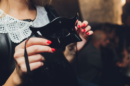 Hand holding beautiful of carnival mask with feather.の写真素材