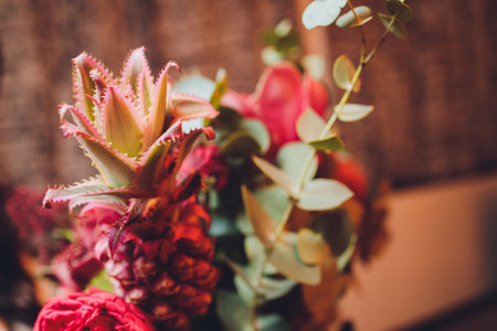 Unusual gift in the form of a bouquet of flowers and fruits. View from above.の写真素材