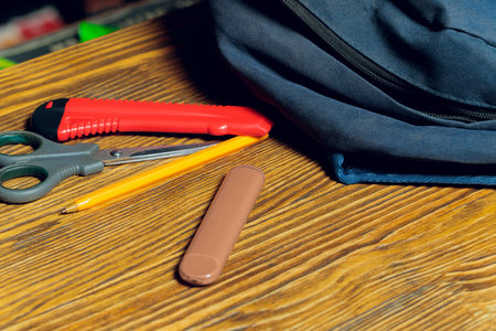 POD e-cigarette or nicotine vapor stick a by school bag.の写真素材