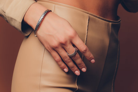 close up of boho styled woman hands with silver jewelry.の写真素材