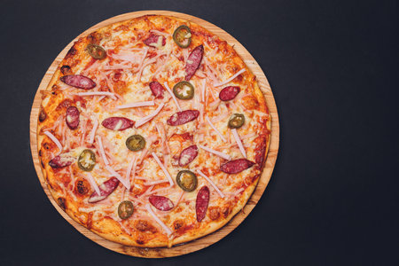 Top view of pizza sicilian with salami, zucchini, jalapeno and bell pepper.の写真素材