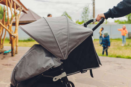 man holding a stroller top view close-up.の写真素材