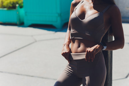 Full length portrait of an athlete woman on the bridge.の写真素材