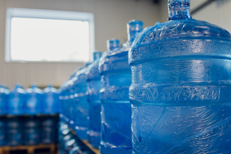 Plastic water bottles on conveyor and water bottling machine industry.の写真素材