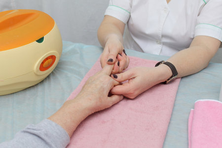 massage therapist doing massage of hands, pressure on certain points.の写真素材
