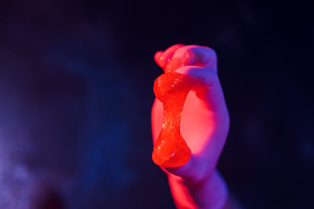 Liquid sugar for skin epilation rubber gloves close-up.の写真素材