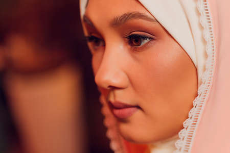 beautiful young woman with a pink hijab.の写真素材