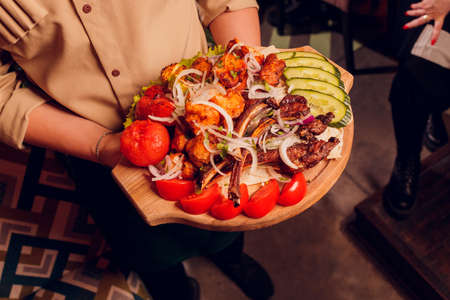 Grilled pork ribs barbeque with vegetables and onion.の写真素材