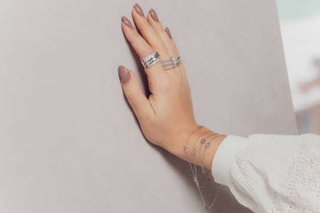 close up of boho styled woman hands with silver jewelry.の写真素材
