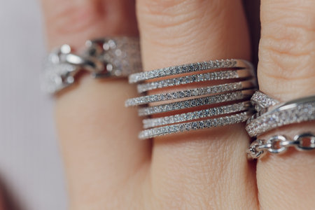 close up of boho styled woman hands with silver jewelry.の写真素材