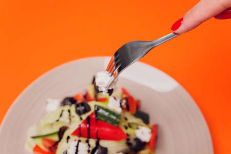 Set of salads on a dark background. Greek salad, Caesar salad, vegetable salad.