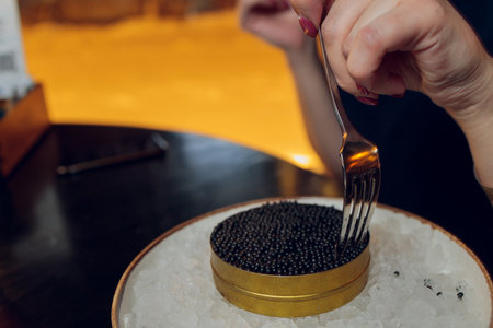paddlefish black caviar in a plastic plate, gourmet and delicious food, close up.の写真素材
