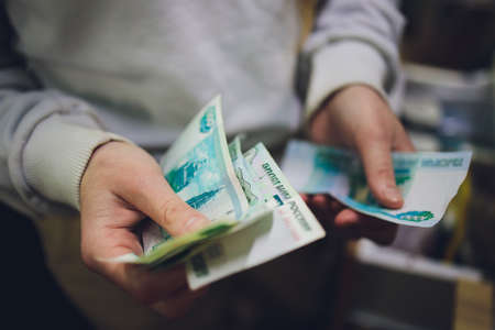 Russian rubles in the hands of a business woman.の写真素材