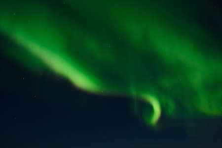 northern light on the silent field before sun rise.の写真素材