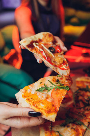 Eating Food. Close-up Of People Hands Taking Slices Of Pepperoni Pizza. Group Of Friends Sharing...